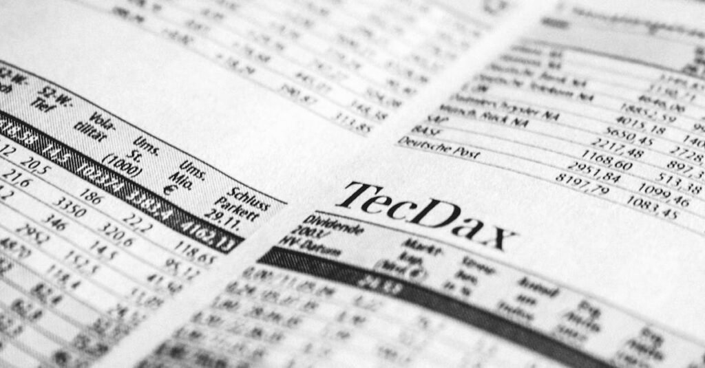 Close-up of a printed stock market report in black and white, highlighting stock prices.